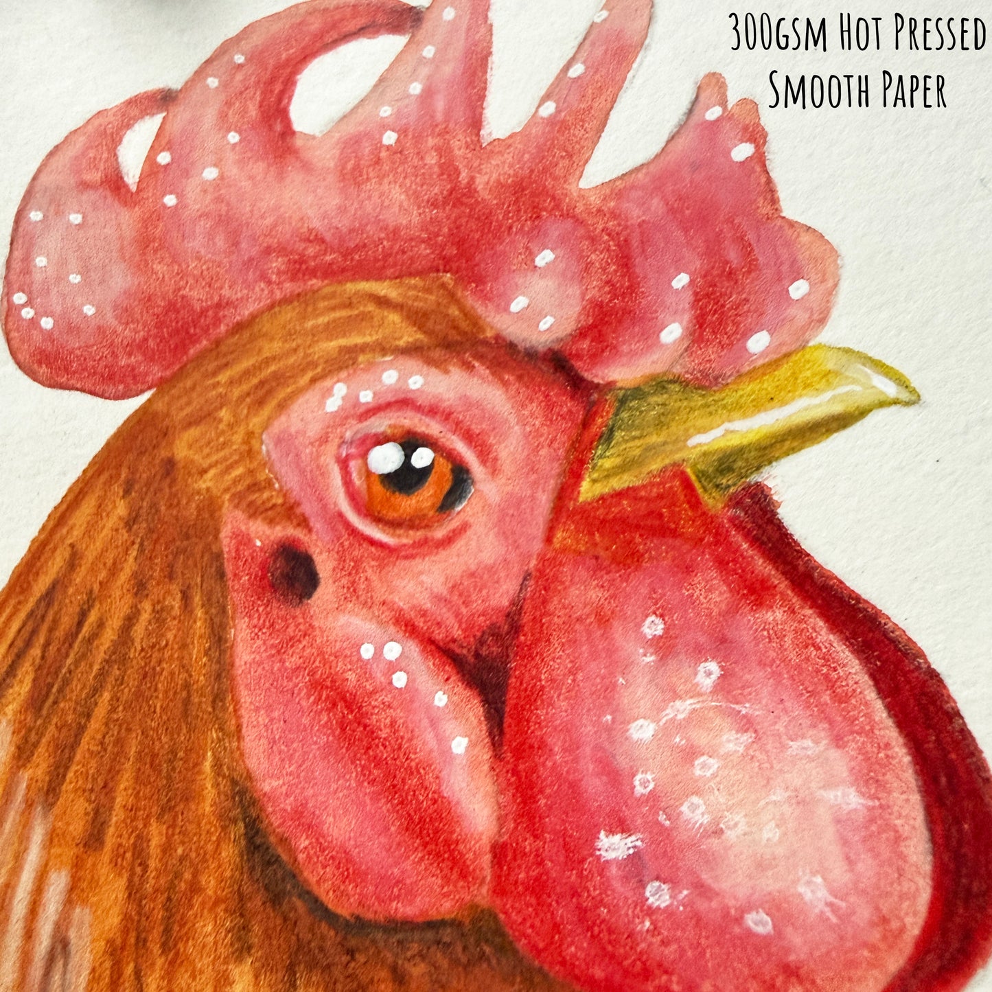 A close of the Rooster bird showing the details and textures of the artwork and paper stock.