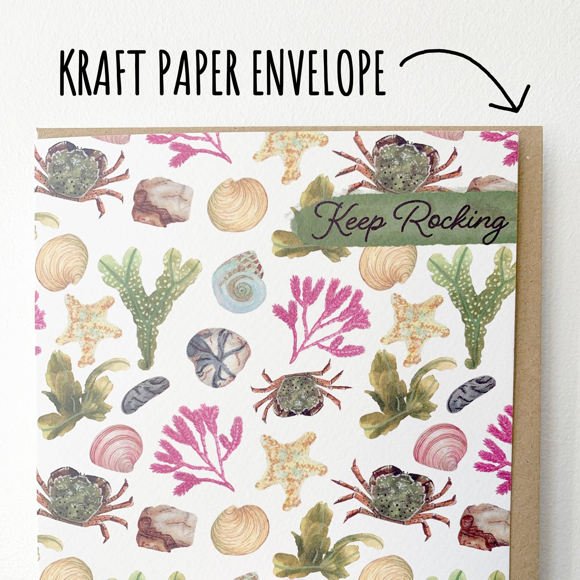 Beach Combing Birthday Card showing the kraft paper envelope on a white surface.