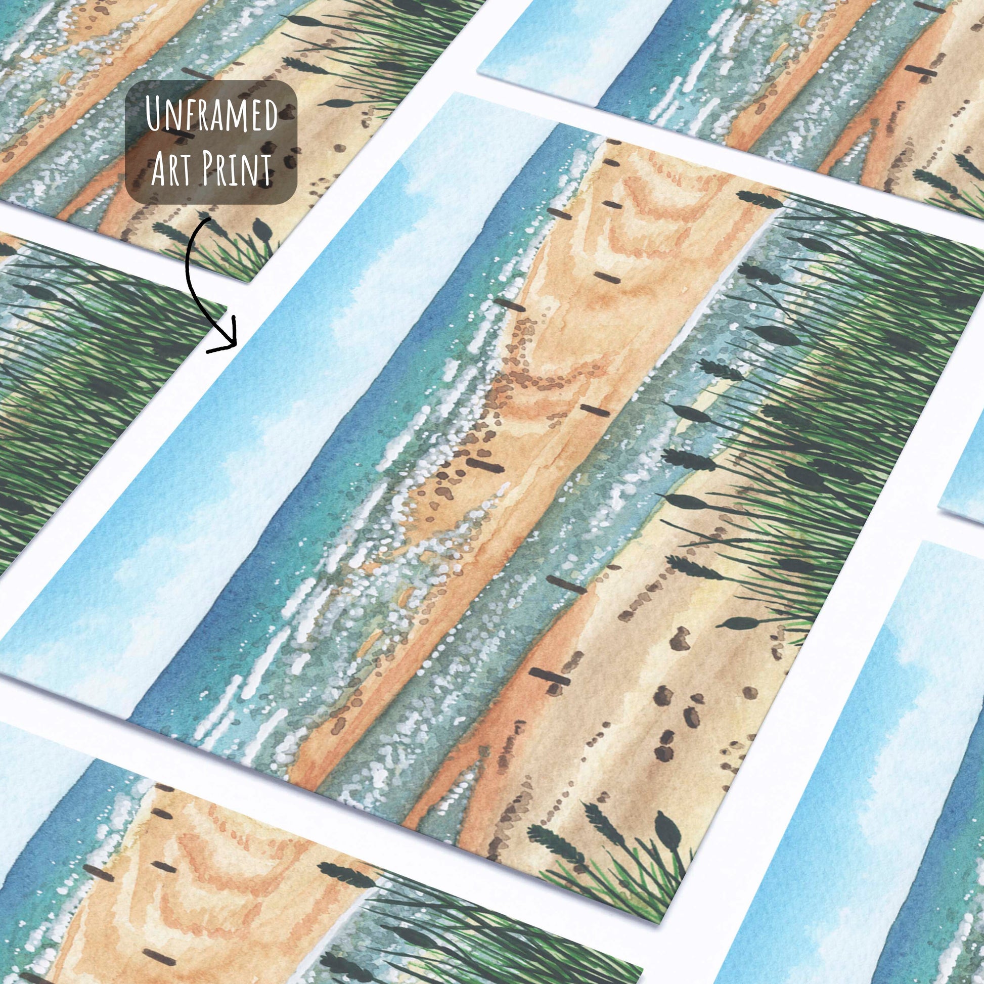Beadnell Bay Art Print laying flat on a white surface.