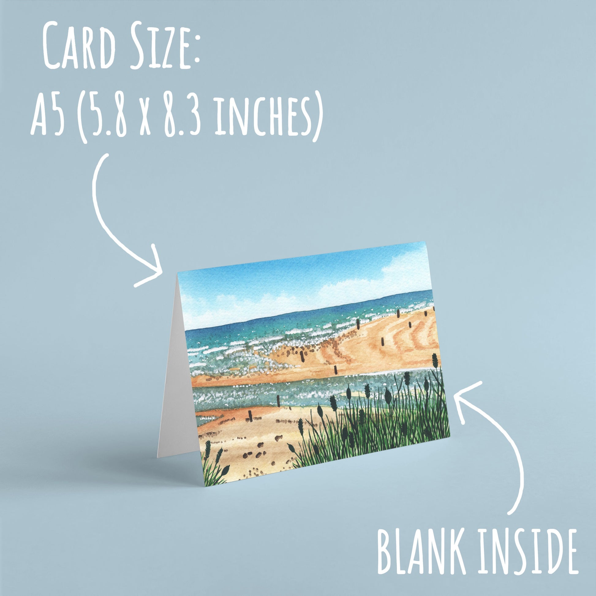 Beadnell Bay beach Birthday Card standing on a pale blue background with the text card size: A5 \9 5.8 x 8.3 inches) and blank inside.