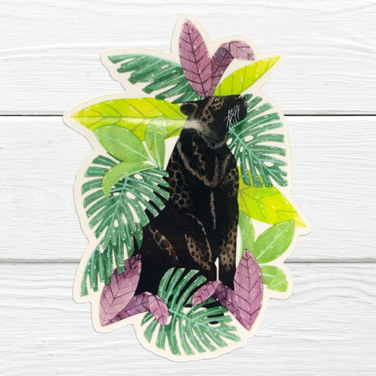 A sticker depicting a black leopard hidden among tropical leaves.