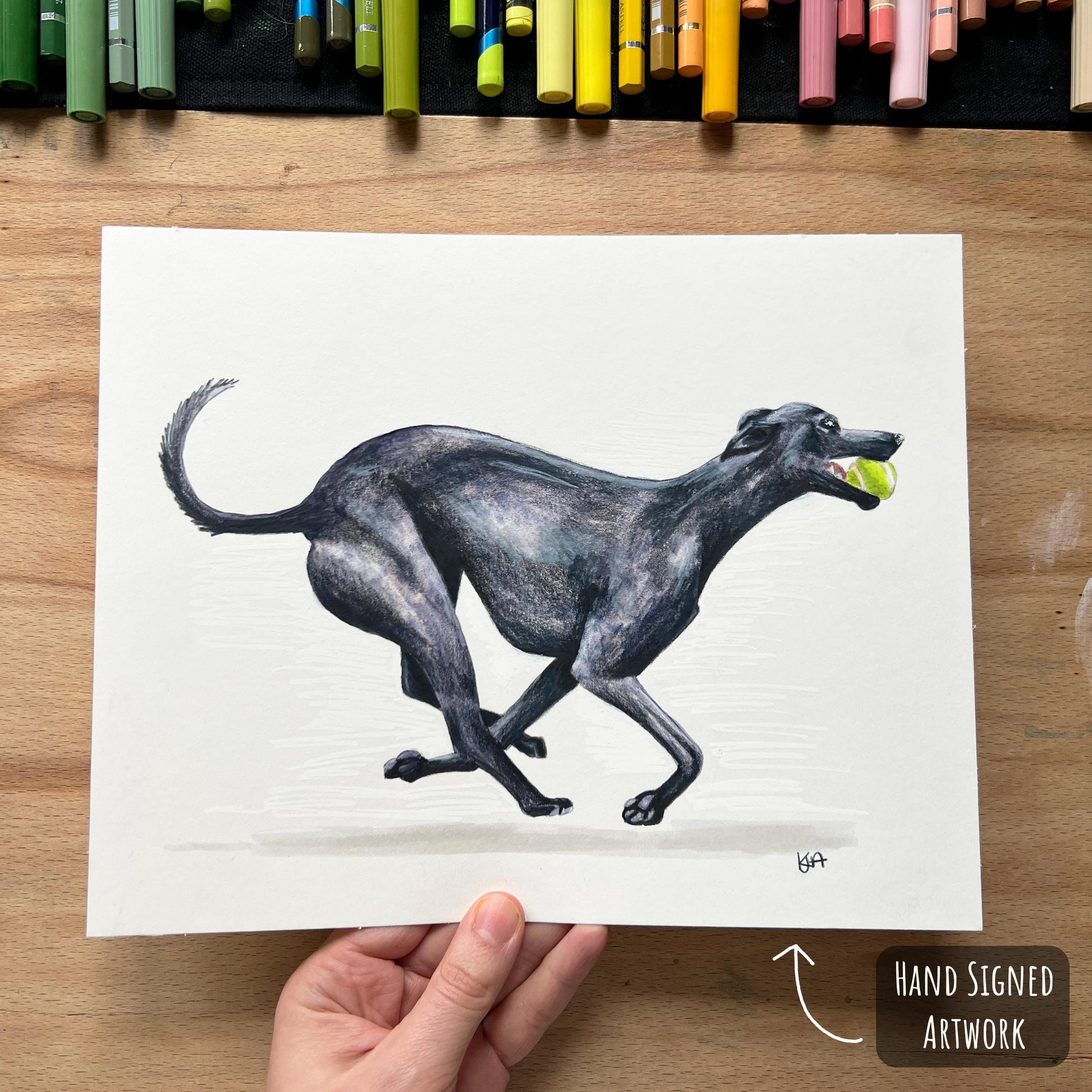 A mixed media artwork of a balck whippet dog thats been hand signed