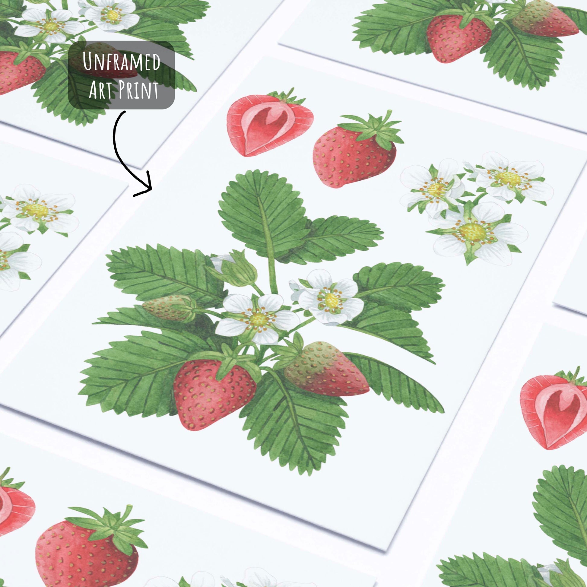 Botanical Strawberry Art Print laying flat on a white surface.