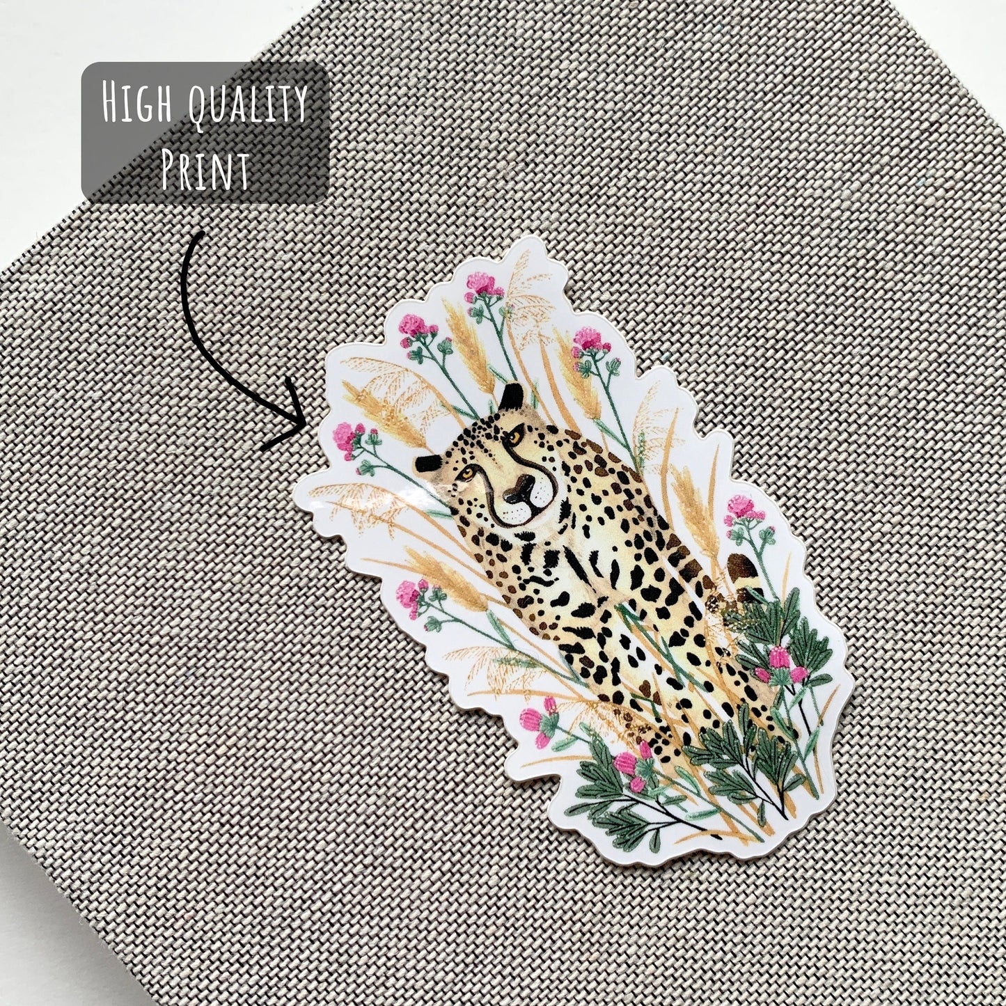 Cheetah Sticker placed on the front of a notebook.
