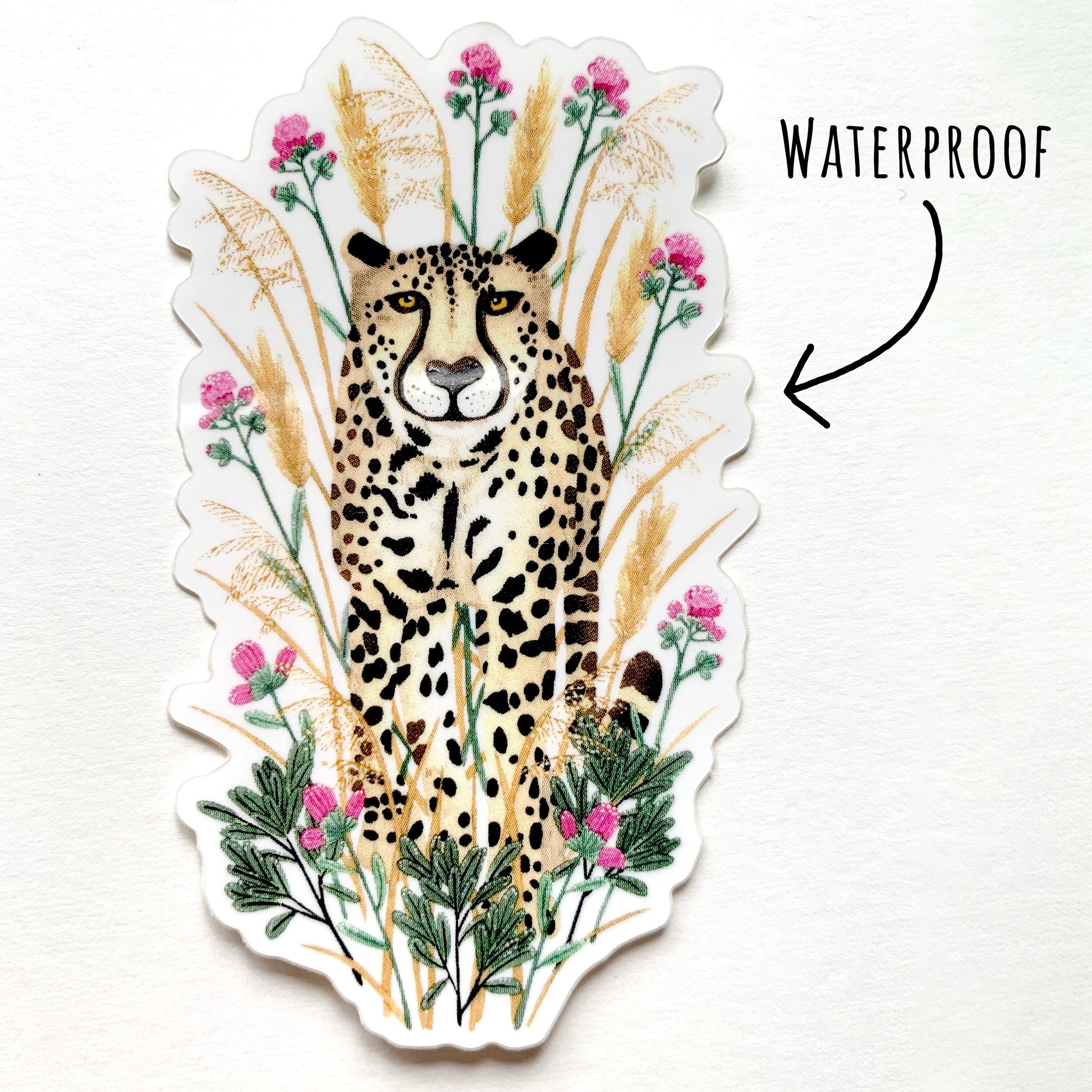 Cheetah Sticker laying flat on a white surface with the text waterproof.