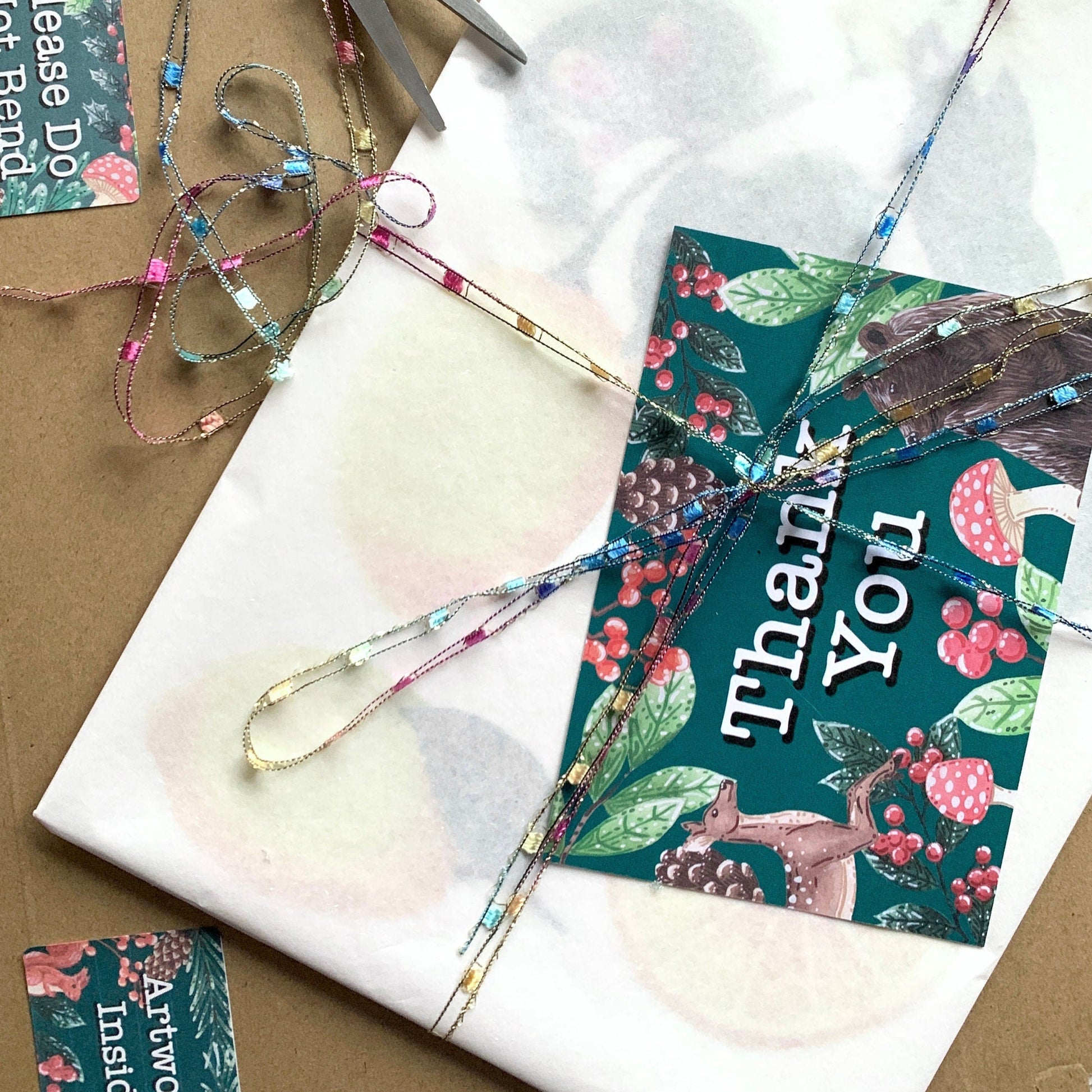 packaging of artwork or print. wrapped in tissue with a backing board and placed into a hard back envelope with a thank you card.