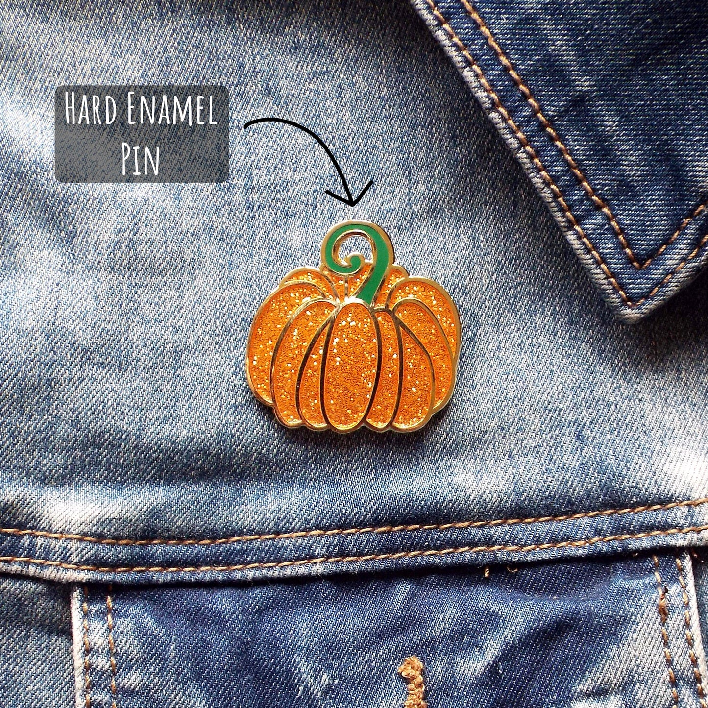 Fairytale Pumpkin Enamel Pin Badge pinned to a blue denim jacket with the text hard enamel pin. 