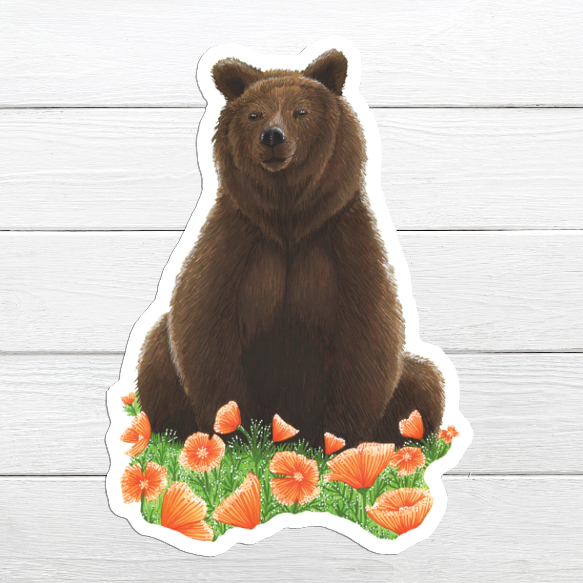 A sticker depicting a brown grizzly bear sitting with Californian orange poppies in the background.