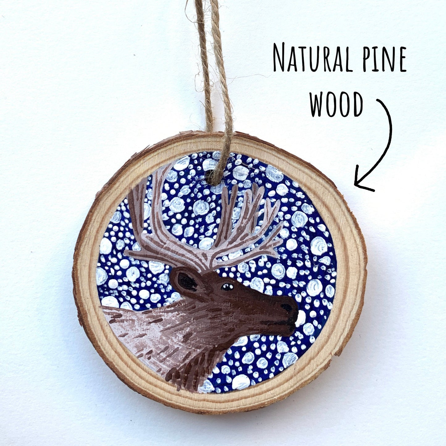 Hand Painted Reindeer Wood Slice Ornament on a white background with the text natural pine wood.