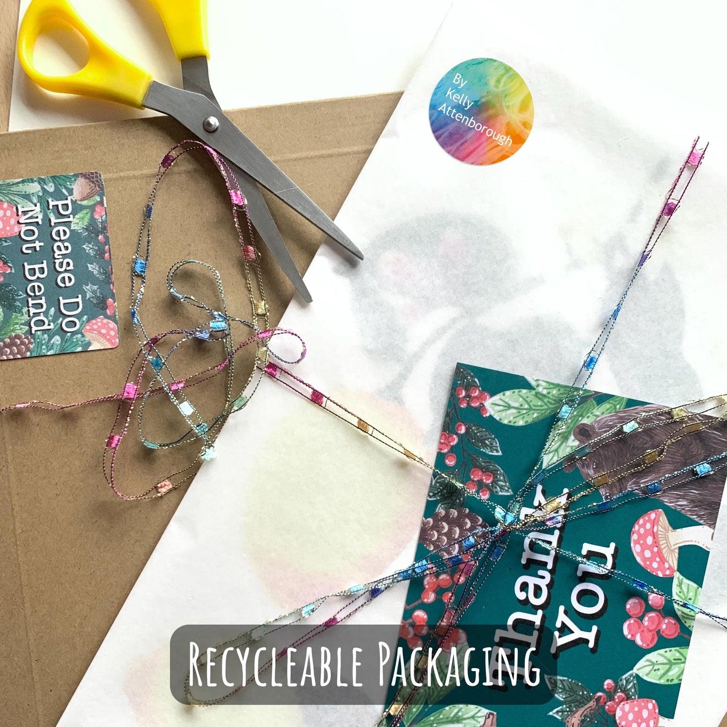 showing the packaged that your print will be sent in,. wrapped in tissue paper with a backing board and placed in a hard backed envelope with a thank you card.