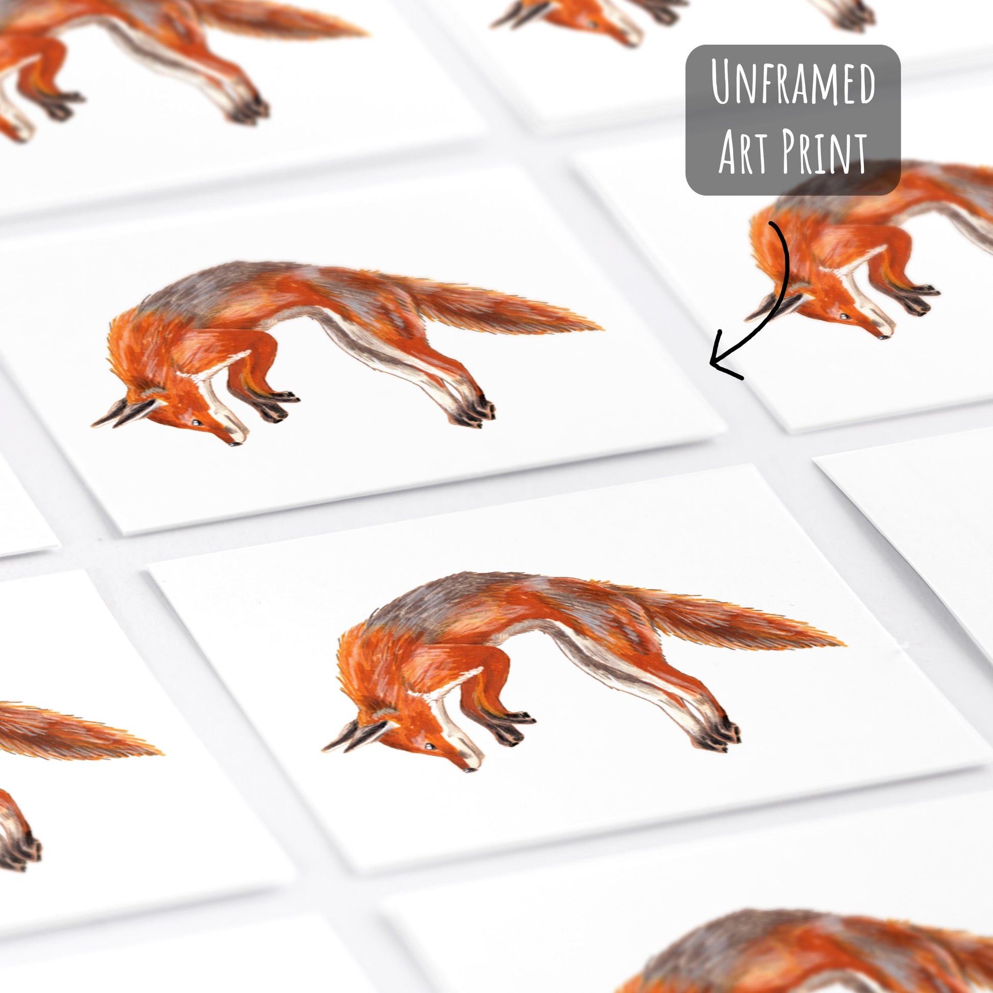Jumping Red Fox Art Prints unframed laying flat on a white surface.