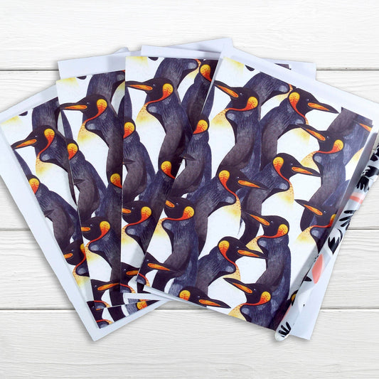 A set of note cards with a watercolour penguin pattern displayed on a white surface. pack of 4 cards.