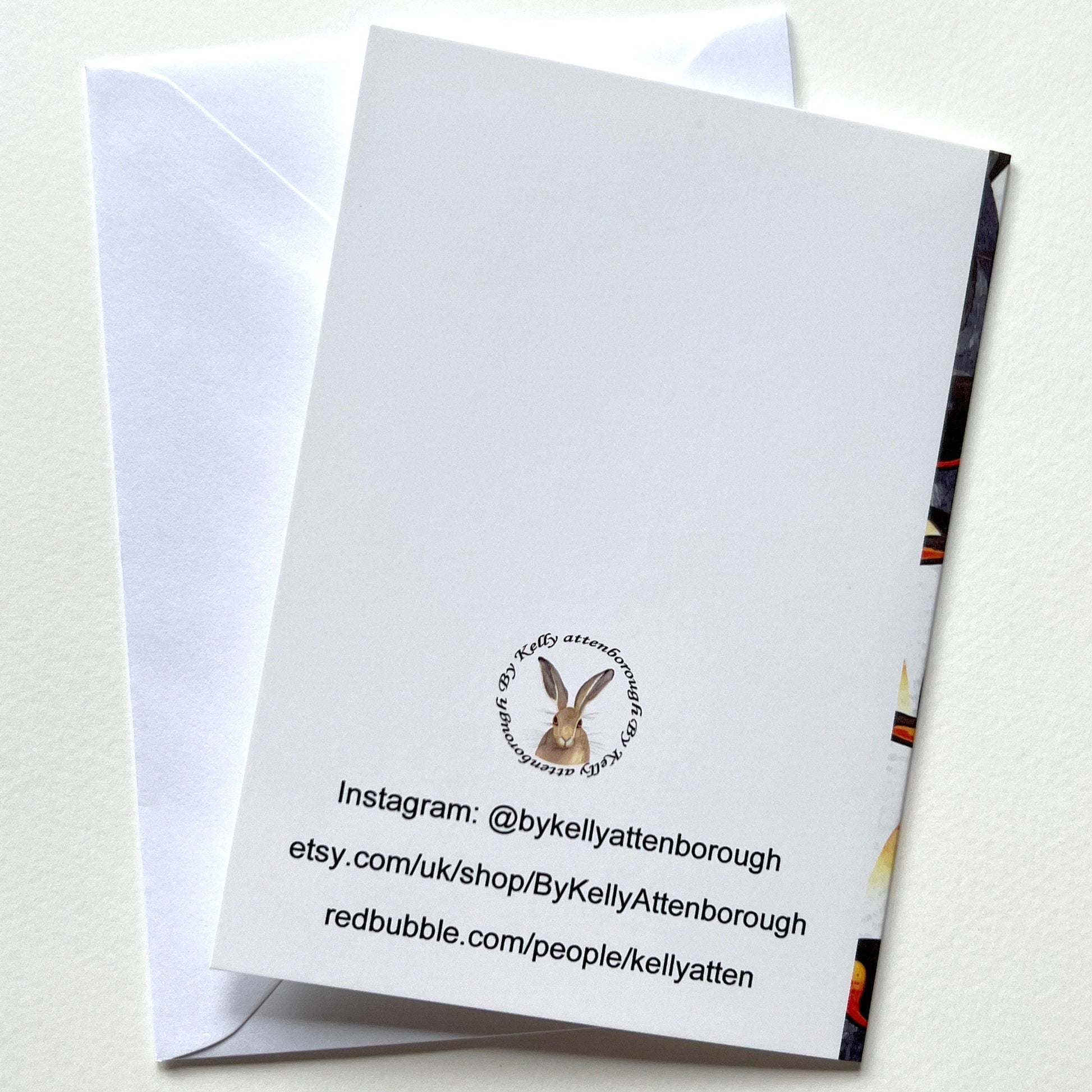 Showing the King Penguin Watercolour Note Cards back with brand logo and website link. laying flat on a white surface