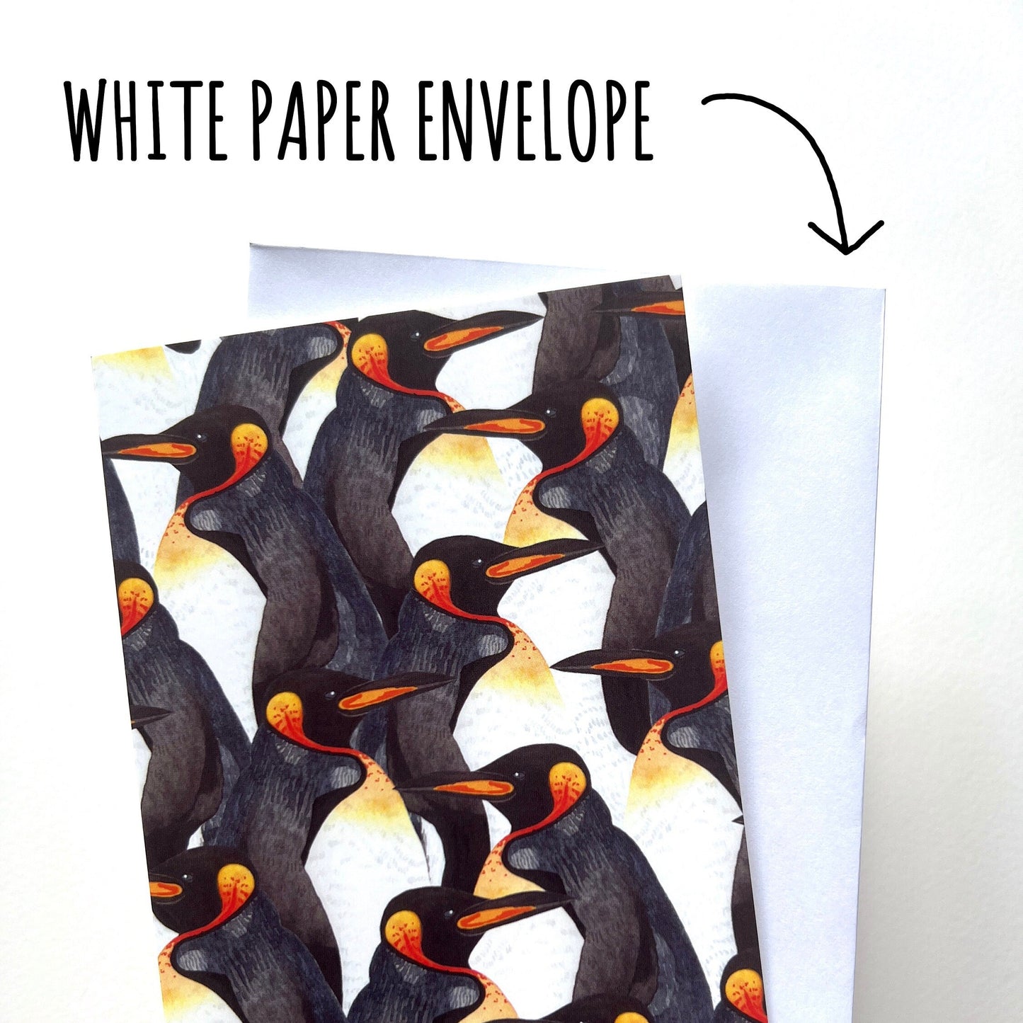 Card with penguin design held over a white paper envelope labeled 'White Paper Envelope'.