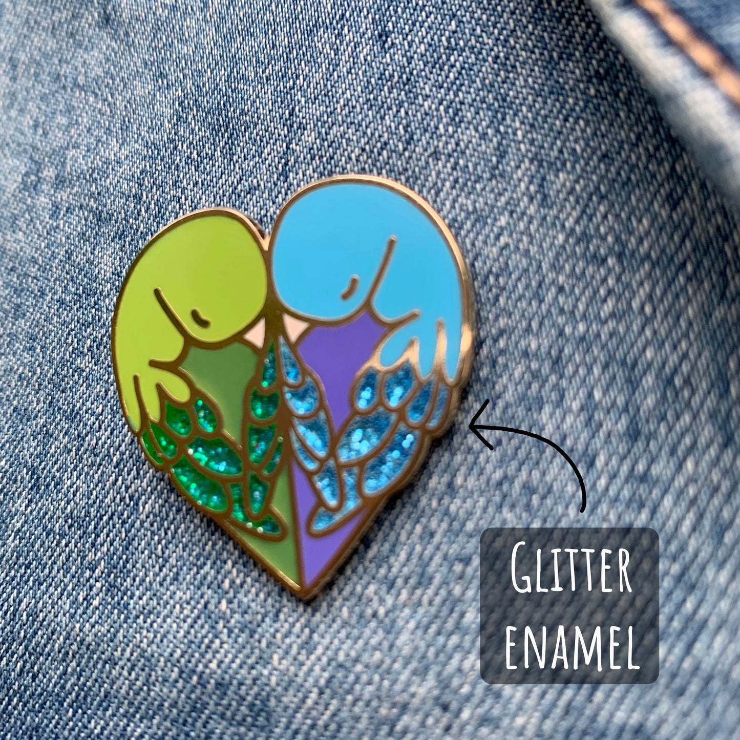 Love Birds Enamel Pin badge close up showing the details and textures of the enamel pin badge With the text Glitter enamel.