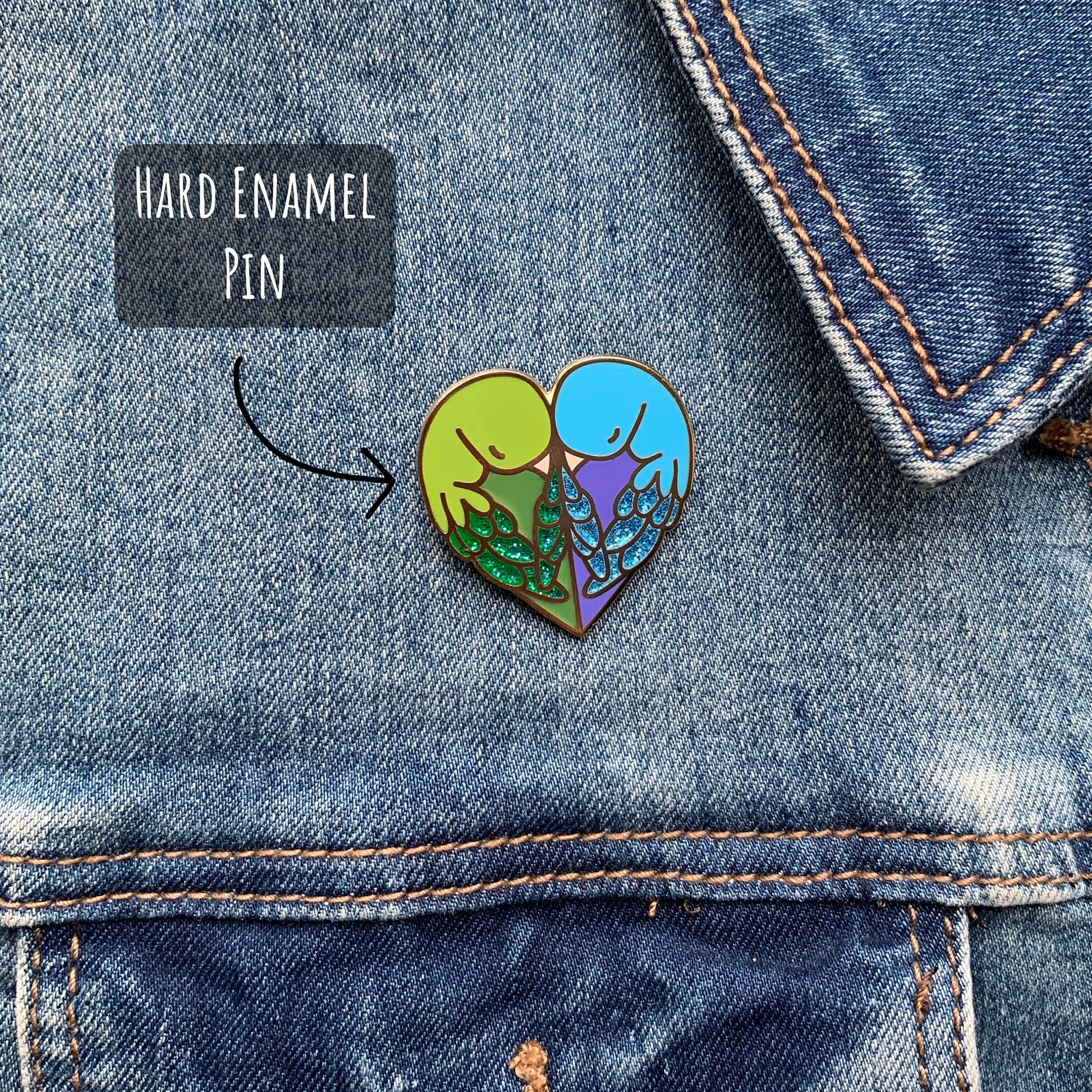 Love Birds Enamel Pin badge pinned to a blue denim jacket with the text hard enamel pin