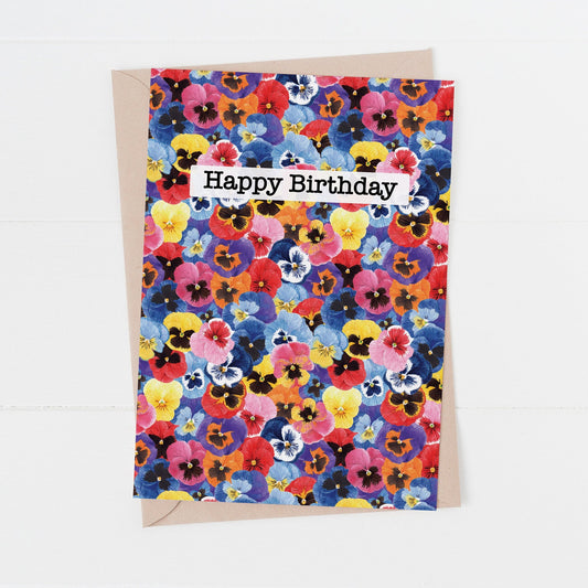Greeting card with colorful floral design and 'Happy Birthday' text on a white background