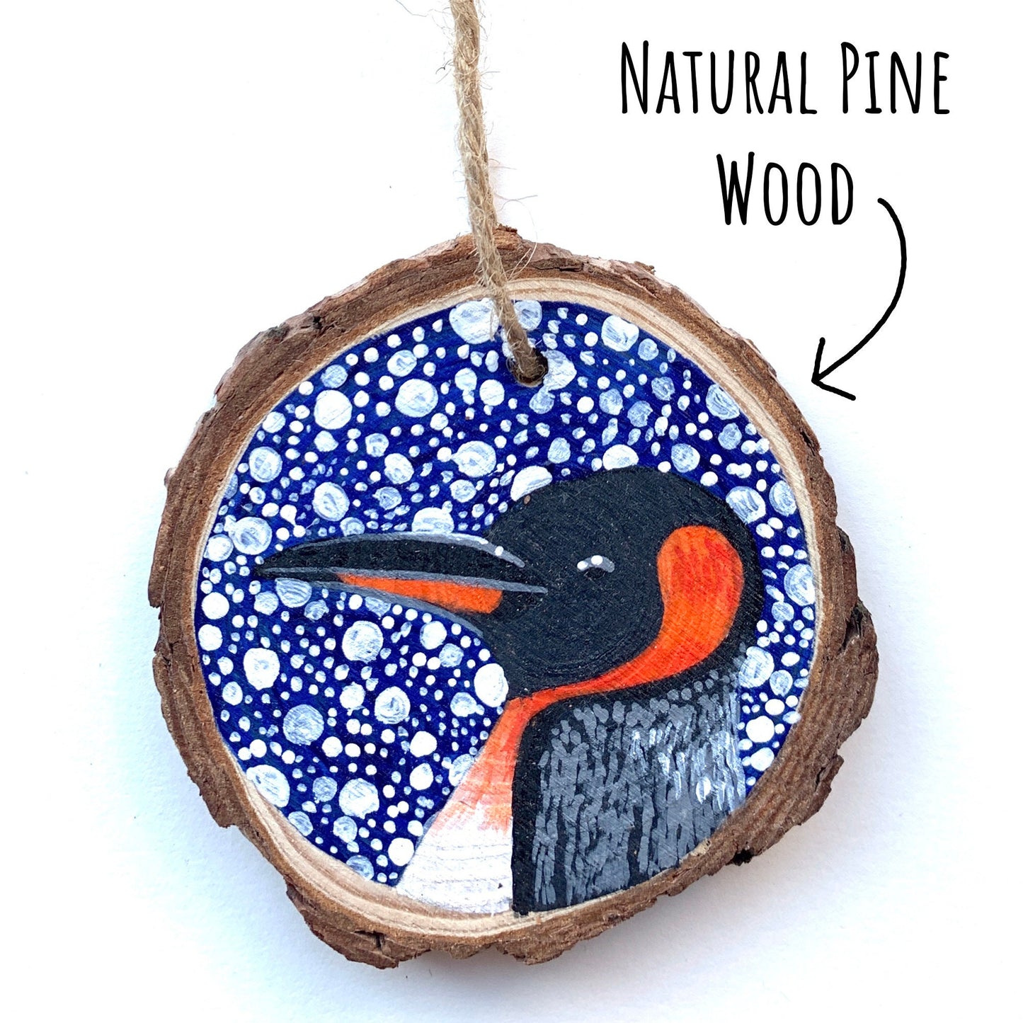 Penguin Wood Slice Ornament on a white background with the text natural pine wood.