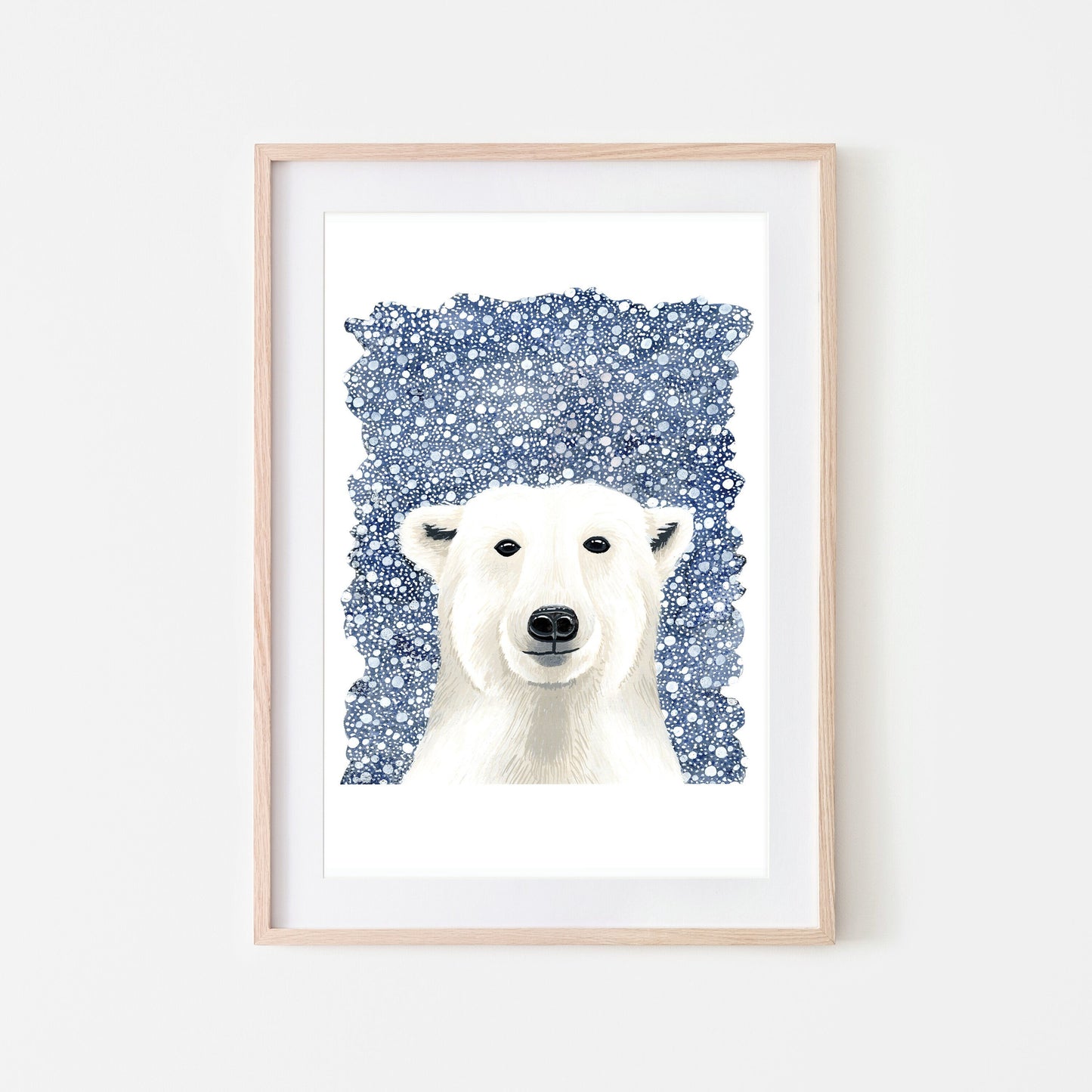 A framed art print of a white polar bear on a dark blue snowy background, with a white border around the illustration.