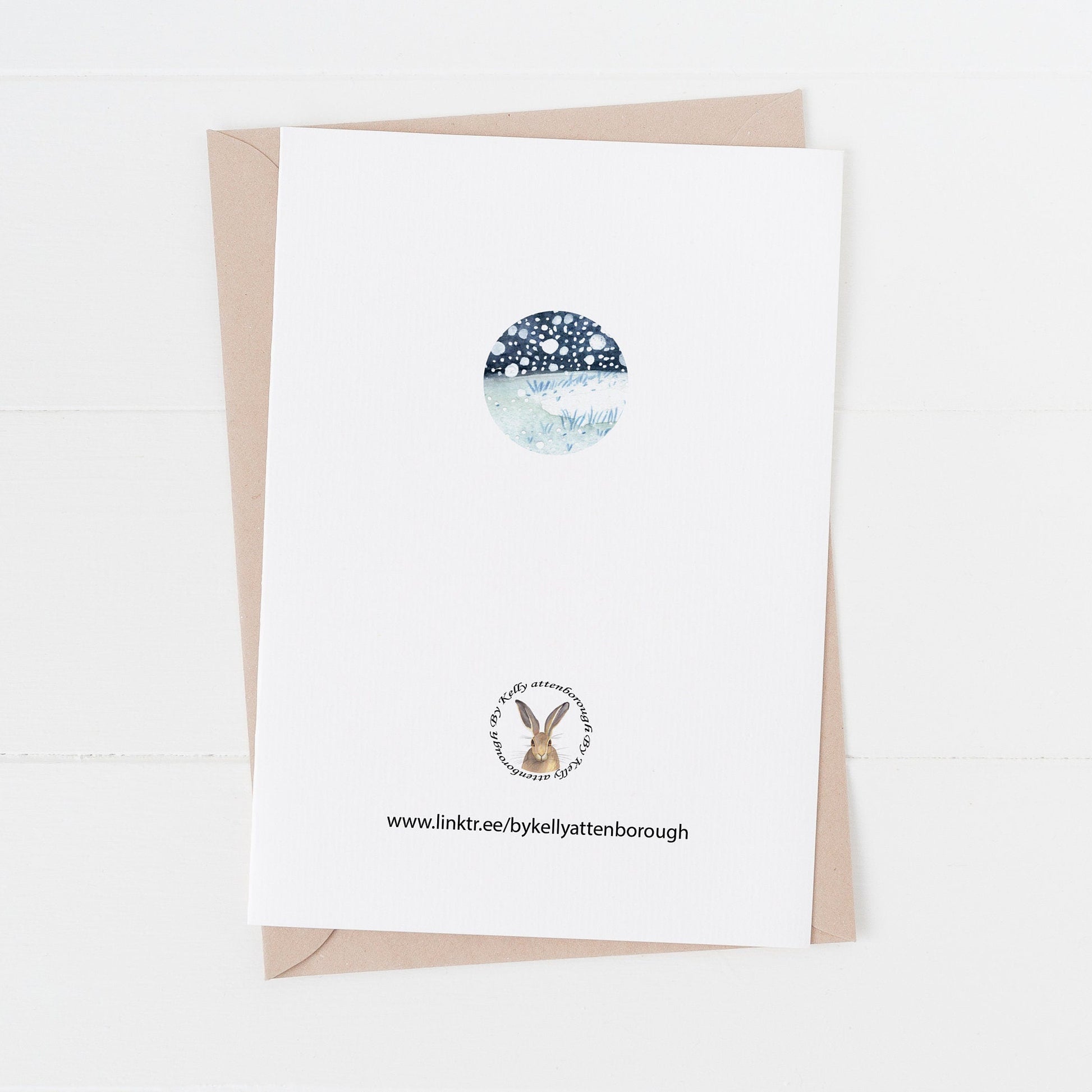 Greeting card back with a rabbit logo illustration and text on a white background