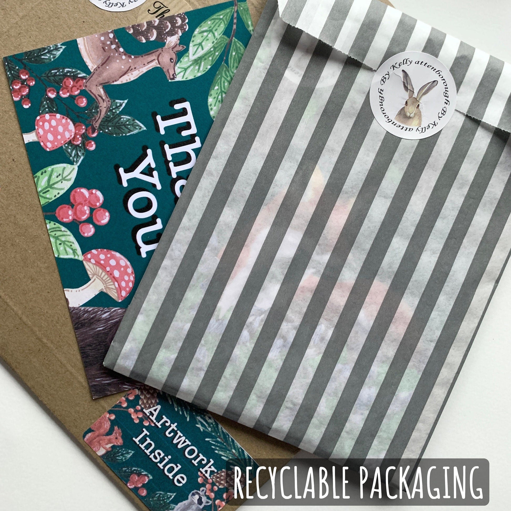 Two envelopes with decorative designs and a striped envelope, accompanied by scissors and text about recyclable packaging.