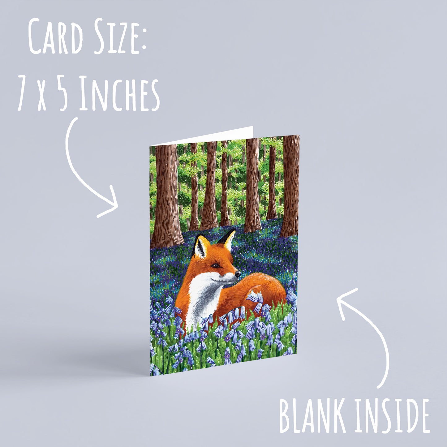 Red Fox with bluebells Birthday Card standing up right with a pale purple background. with the text card size: 7 x 5 inches and blank inside.