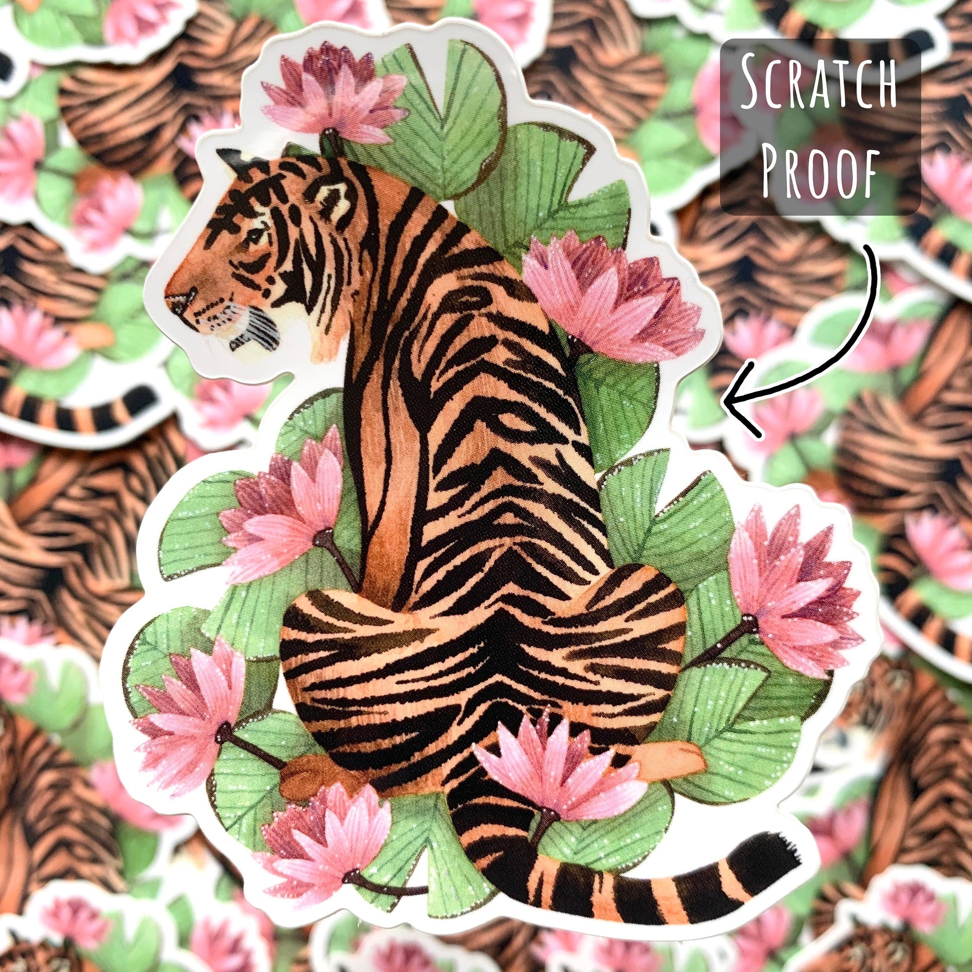 Tiger and Pink Lilies Sticker with out of focus Tiger and Pink Lilies Stickers in the background with the text sratchproof.