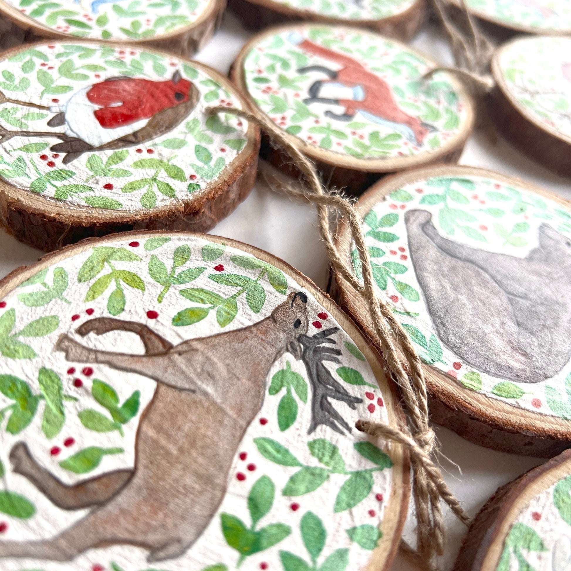 Woodland Animal Christmas Ornaments close up showing the details of the painted animal illustrations.