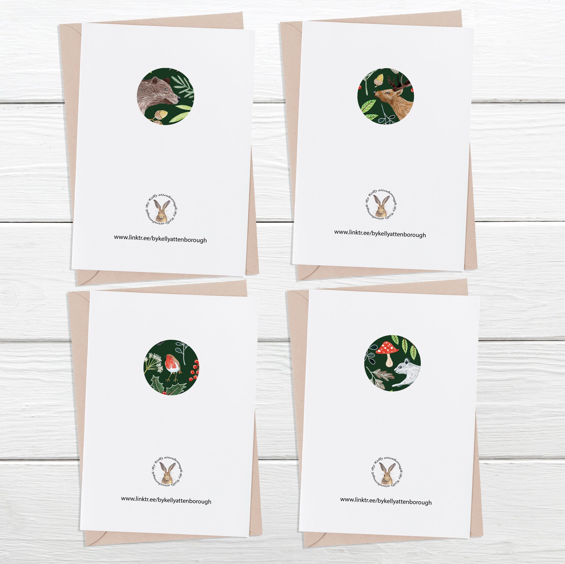 showing the back of the Woodland Animal Christmas cards on a white wood background.