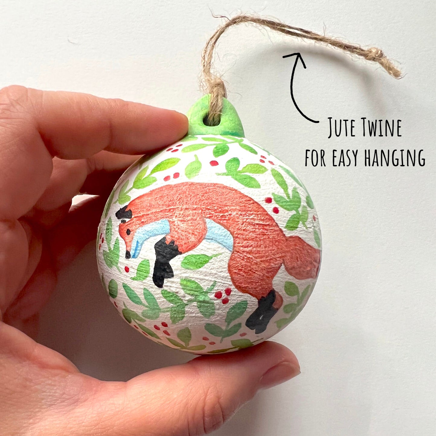 showing the fox of the Woodland Animals Ceramic Baubles on a white back ground with the text Jute Twine for easy hanging.