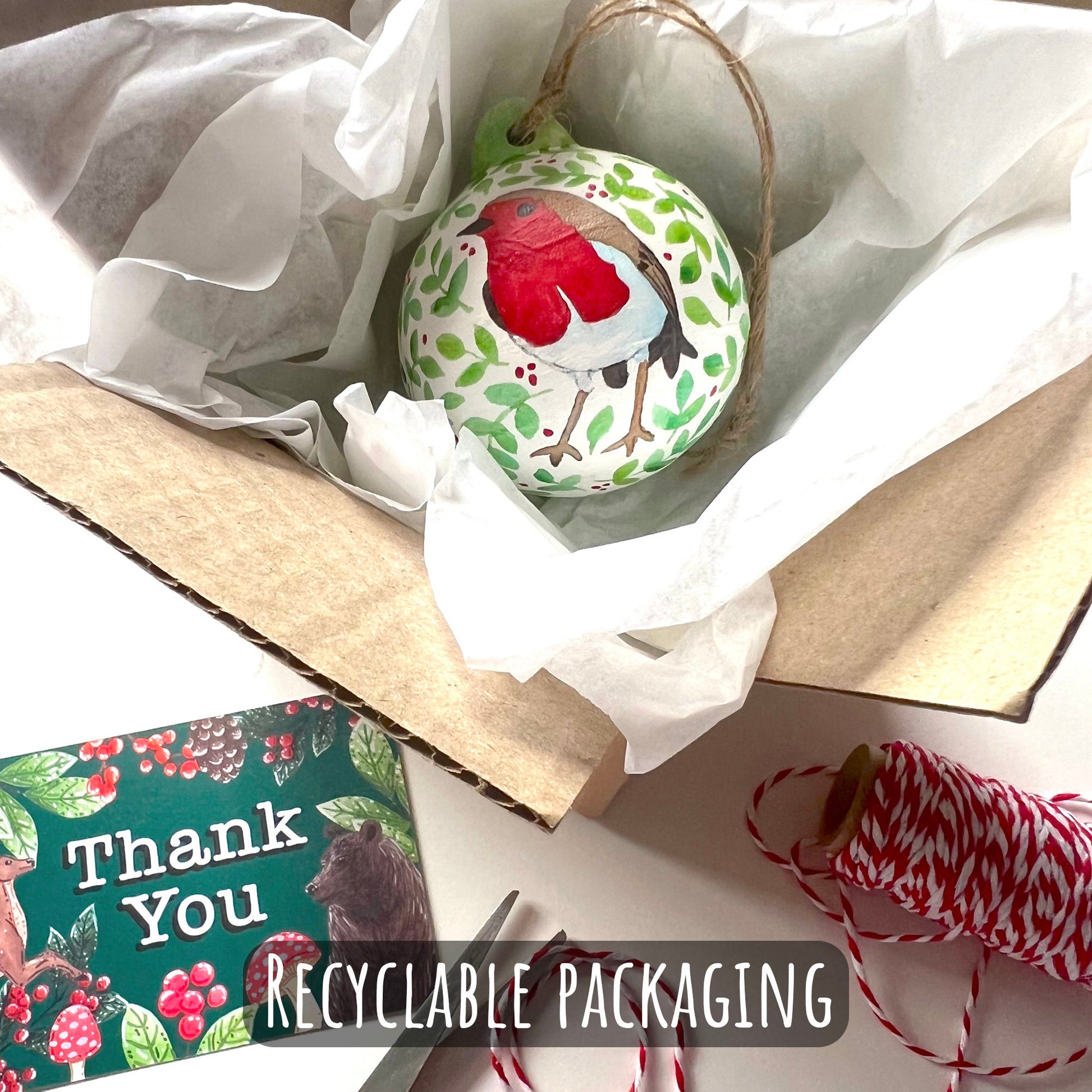 showing how your bauble will be posted to you. wrapped in tissue and bubble wrap and placed into a box with a thank you card.