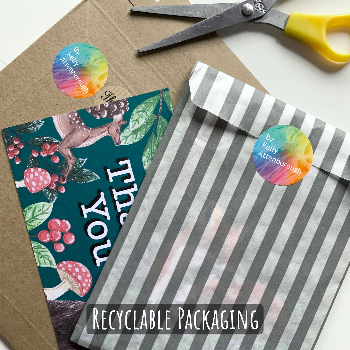 showing how your sticker sheet will be packaged. Placed in a paper sleeve, then into a hard backed envelope with a thank you card.