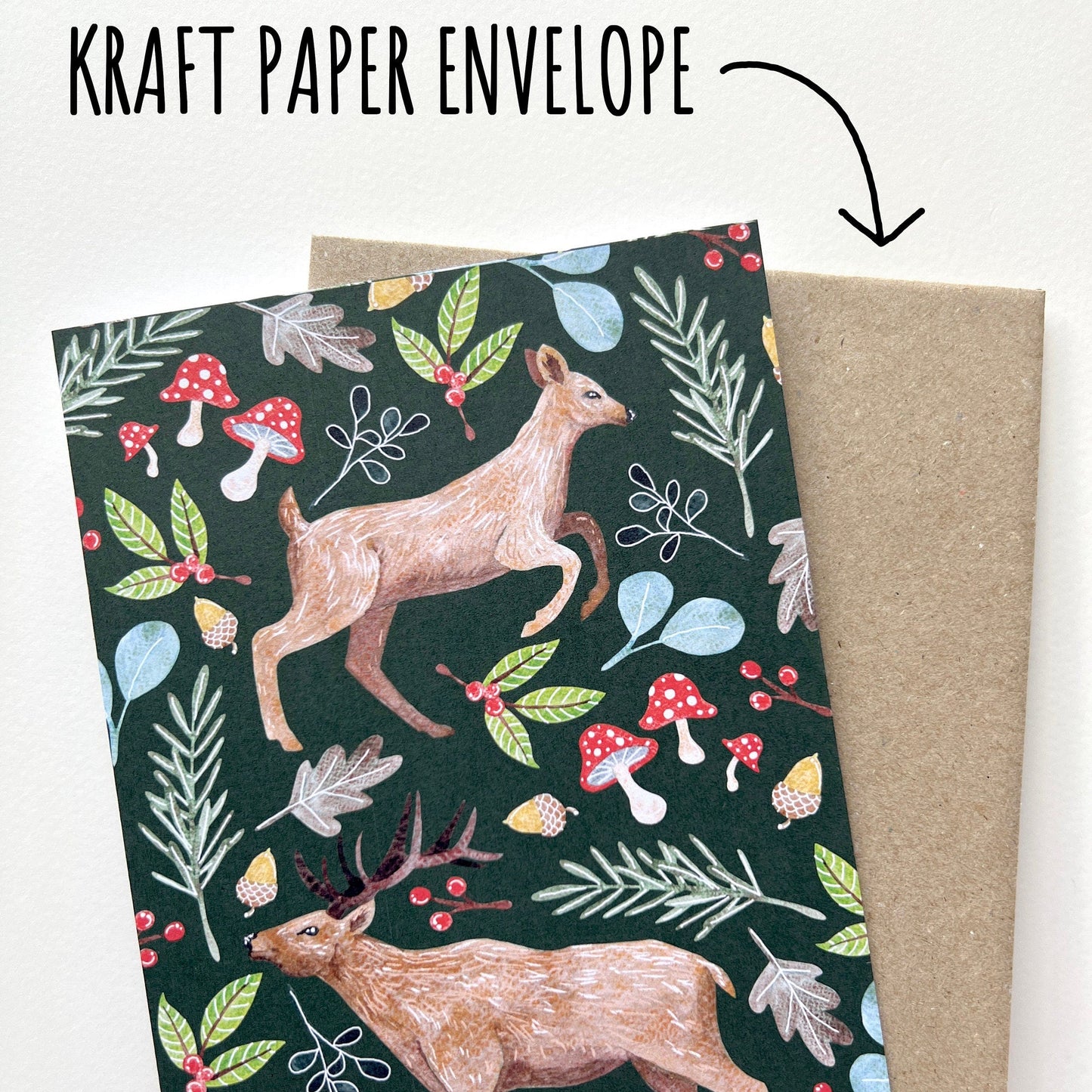 Woodland Stag and Doe Deer Christmas Card with a kraft envelope on a white background with the text kraft paper envelope.
