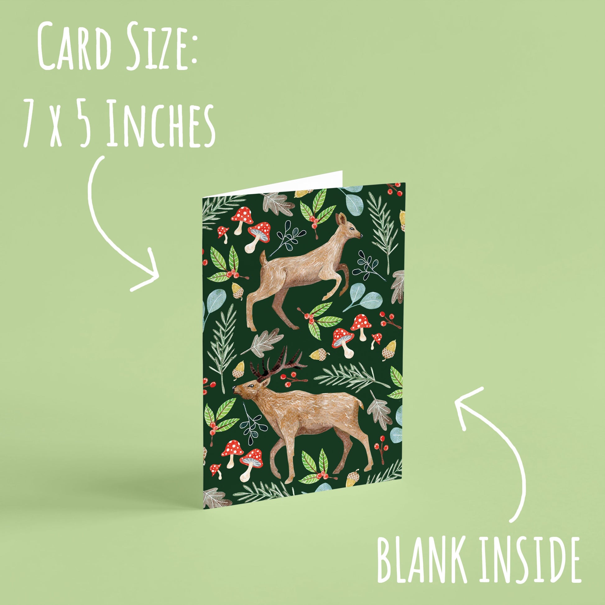 Woodland Stag and Doe Deer Christmas Card standing upright on a pale green background. With the text card size: 7 x 5 and blank inside.